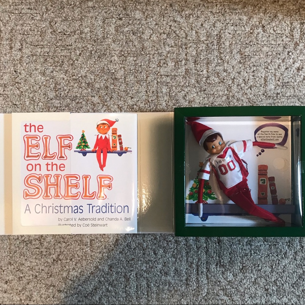 Elf on the Shelf book with elf in removable shirt